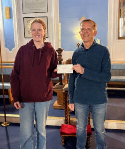 Our picture shows W Bro John Murphy, Falcon Lodge Treasurer, presenting Izzy with a contribution of £250.